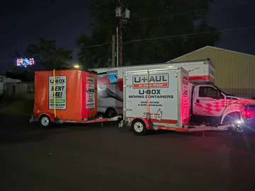 Moving containers secured on trailers during an evening route