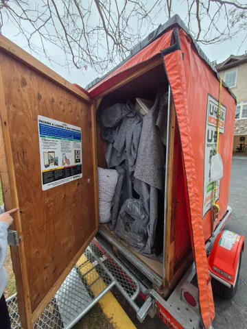 Protected furniture and household items secured inside a moving container